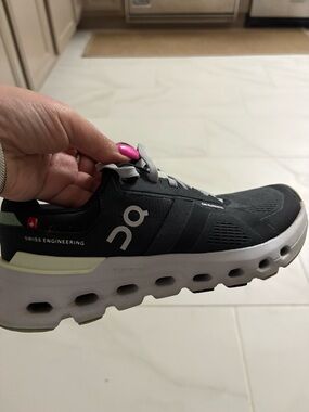 On Running Women’s Black & White Cloudnova Sneakers with Light Green Accents